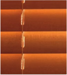 Light from wooden slats bouncing off each other to create radiant areas